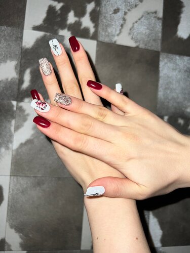 Elegant white floral manicure on female ...