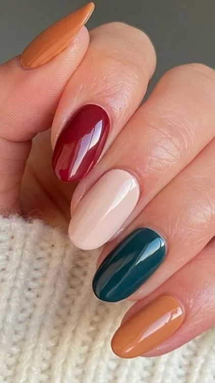 Hands close up. Burgundy beige manicure ...